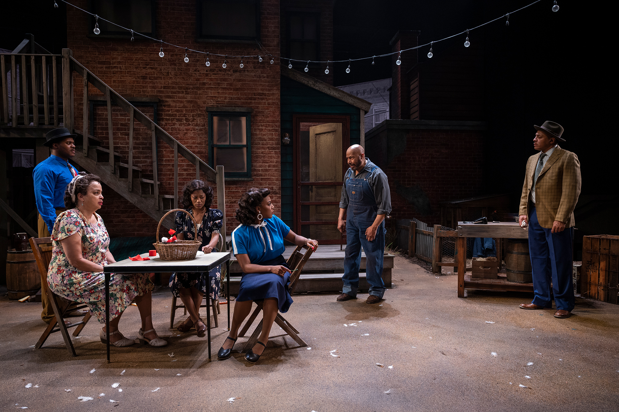 Milwaukee Repertory Theater presents August Wilson’s Seven Guitars in the Quadracci Powerhouse March 7 – April 2, 2023. Pictured: Dimonte Henning, Marsha Estell, Kierra Bunch, Saran Bakari, Kevin Brown and Vincent Jordan. Photo by Michael Brosilow.