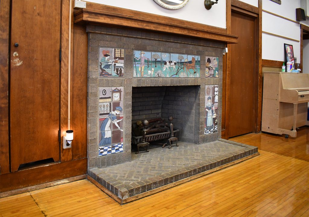 The brick and tiled fireplace at Riley Montessori. Photo by Ben Tyjeski.
