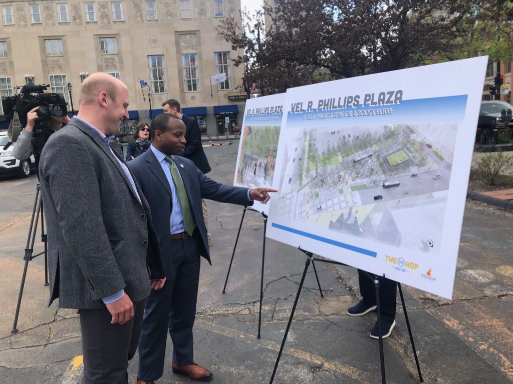 Then council members Nik Kovac and Cavalier Johnson (now budget director and mayor) look at a plan for Vel R. Phillips Plaza in 2019. Photo by Jeramey Jannene.