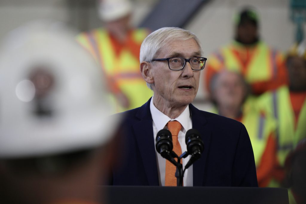 Wisconsin Gov. Tony Evers speaks before President Joe Biden’s arrival at the Laborers’ International Union of North America training center in DeForest, Wis., on Feb. 8, 2023. Evers proposes in his 2023-25 state budget to broaden eligibility for cleanup funding to people who can show they thoroughly investigated potential contamination before buying a property. (Drake White-Bergey / Wisconsin Watch)