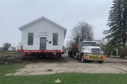 Little White School House being moved. Photo courtesy of the Republican Party of Milwaukee County.