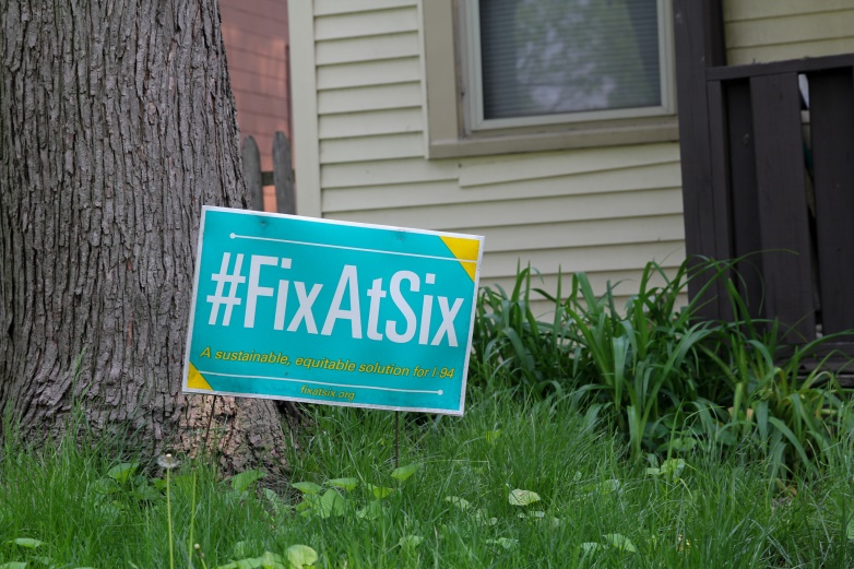 Fix at Six” signs are scattered throughout neighborhoods in Milwaukee on May 18, 2023. Opponents of the state’s proposed Interstate 94 East-West Freeway corridor expansion are pushing an alternative plan by that name. It calls for the state to still repair — but not widen — a 3.5-mile section of freeway while also investing in public transit and cycling infrastructure. Opponents of the state’s plan say it benefits suburban commuters at the expense of Milwaukee residents. (Jonmaesha Beltran / Wisconsin Watch)