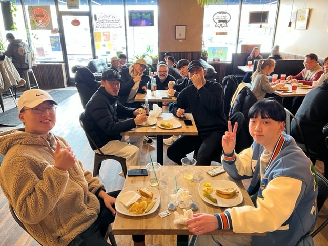 Engineering students from Korea visit Planet Perk at City Center in Oshkosh earlier this year. Planet Perk has been a part of the Oshkosh community for more than 20 years. Photo Courtesy of Planet Perk.