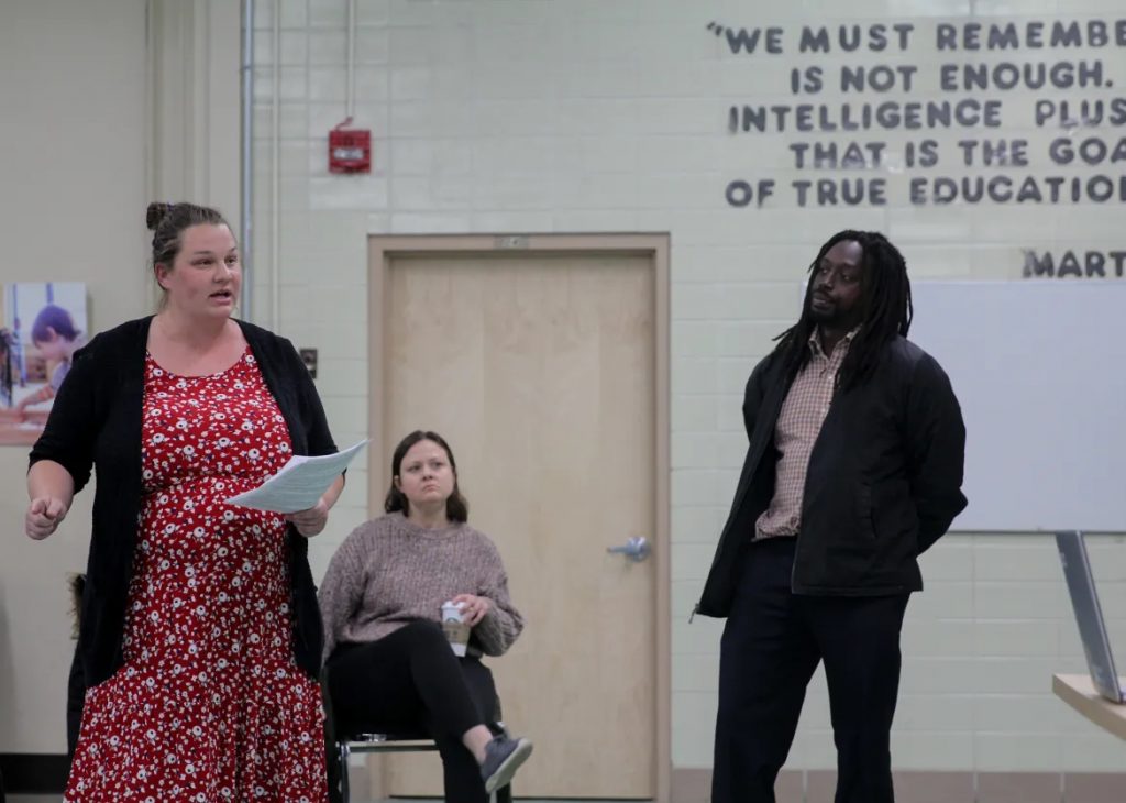 Amy (left) and Martice Scales (right) speak during an April 19, 2023 meeting at Penfield Montessori Academy after the Milwaukee-based charter school announced plans to close at the end of the school year. The school serves many students with disabilities, and the announcement of the closure unleashed chaos at the Scales home, where their overwhelmed children — Penfield students — cried and threw toys. “It’s heartbreaking,” Martice says. “As a parent it makes you feel like you’ve failed them.” (Jonmaesha Beltran / Wisconsin Watch)
