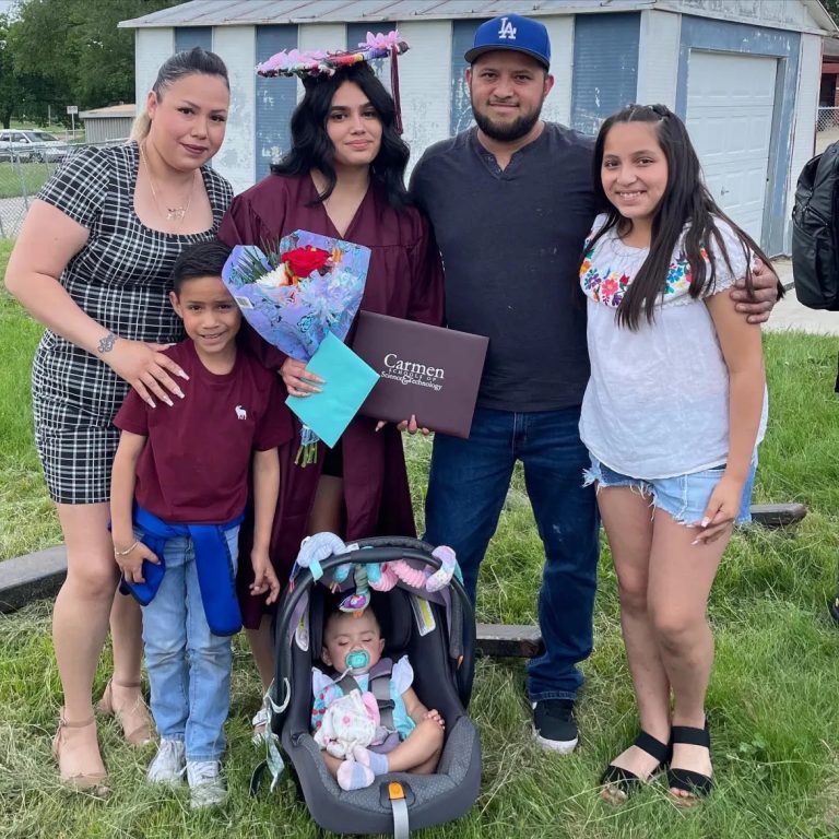 Milwaukee mom Diana Rico, left, poses with family following the high school graduation of her oldest daughter, also named Diana (in graduation gown) in 2022. Also shown are Rico’s son Bryan (to her right), husband Rigo, daughter Katalina (in car seat) and daughter Sheyla. (Courtesy of Diana Rico)