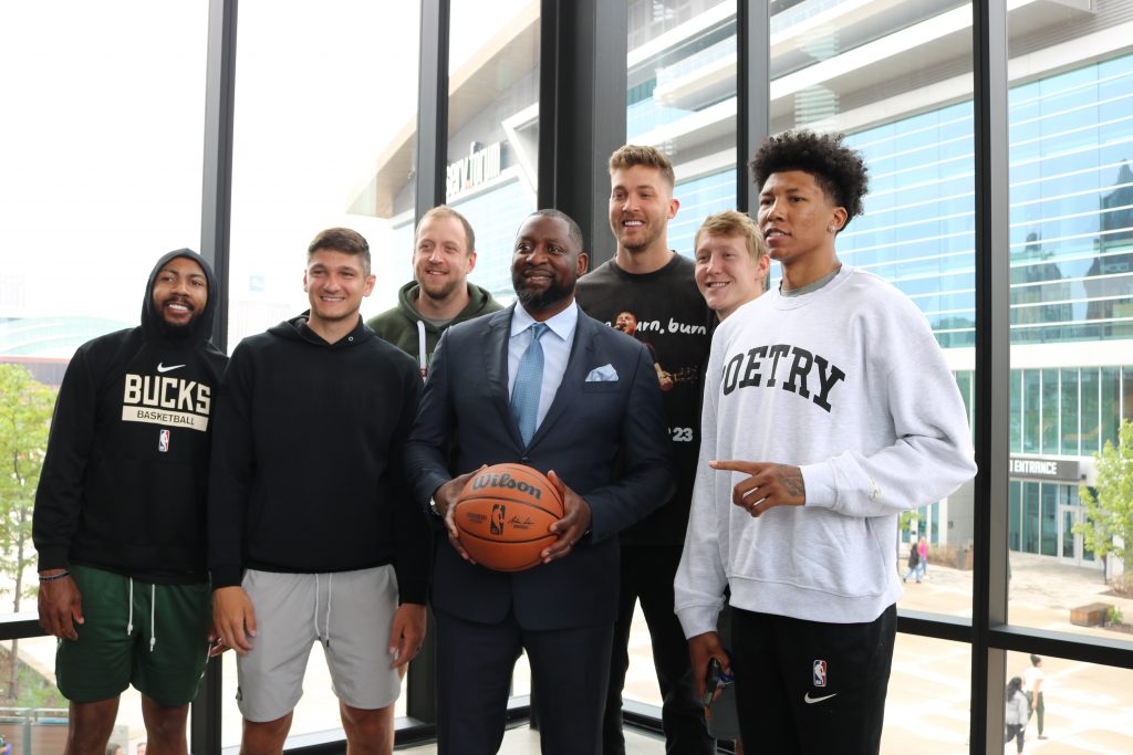 Adrian Griffin (center) with Milwaukee Bucks players at Tuesday's press conference. Photo taken June 6, 2023 by Sophie Bolich.