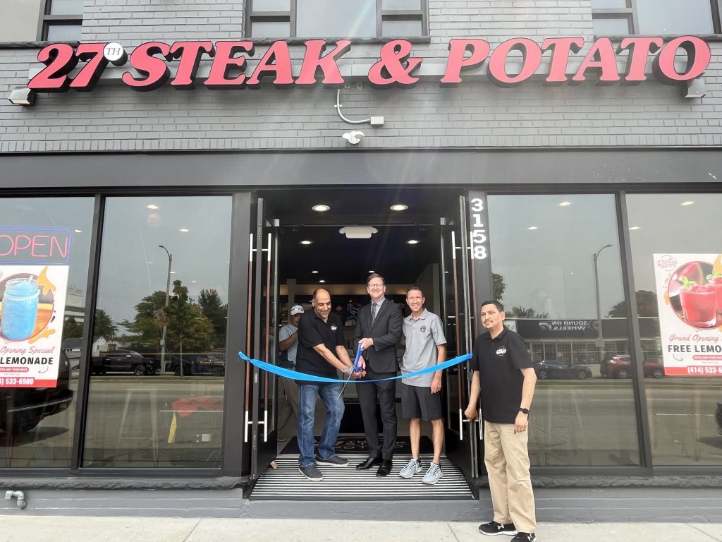 Osama Abushanab (left), Alderman Scott Spiker, Sup. Steve Taylor and Mohammad Imran at a ribbon-cutting for 27th Steak & Potato. Photo taken June 20, 2023 by Sophie Bolich.