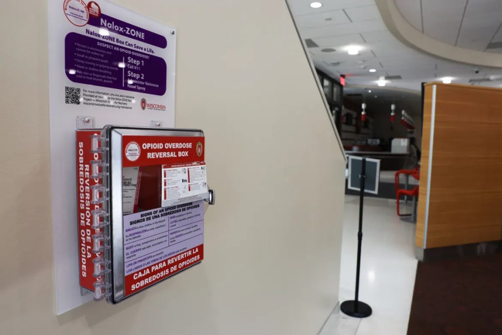 A box containing free naloxone, also commonly known by the brand name Narcan, hangs in Gordon Dining and Event Center on the University of Wisconsin-Madison campus. The box was provided through the Nalox-ZONE Program which aims to increase naloxone availability throughout Wisconsin to reduce opioid deaths. (Drake White-Bergey / Wisconsin Watch)