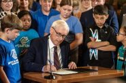 Gov. Tony Evers signs the 2023-2025 biennial budget Wednesday, July 5, 2023, at the Wisconsin State Capitol in Madison, Wis. Angela Major/WPR