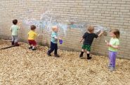 Children paint outside with chalk at Big Oak Child Care in Madison. (Courtesy of Big Oak Child Care | Facebook)