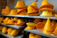 Some of the different types of finished cheeseheads can be seen in the retail space at the Foamation building in Milwaukee, Wisc. Maureen McCollum/WPR