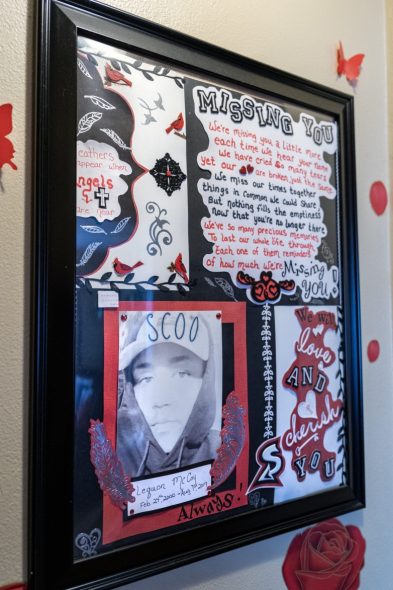 A collage of photos and messages made by family and friends for Le’Quon McCoy’s funeral hangs on the wall at the Milwaukee apartment of Antoinette Broomfield, his mother, on July 25, 2023. McCoy was hit and killed by a driver fleeing Milwaukee police in a stolen vehicle in August 2019. (Kayla Wolf for Wisconsin Watch)