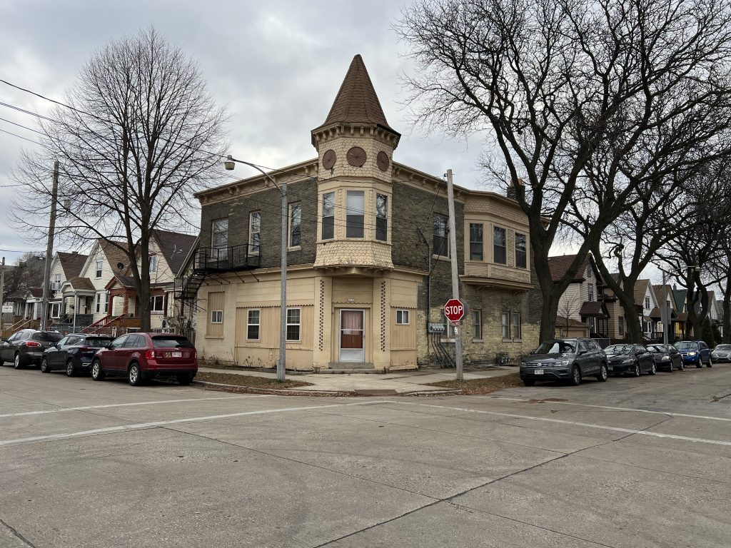 A former commercial building and homes in the Muskego Way neighborhood at the intersection of S. 25th Street and W. Rogers St. Photo by Jeramey Jannene.