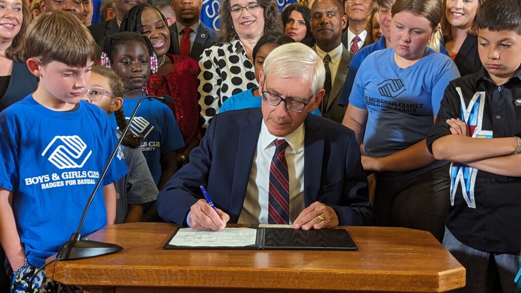 Governor Tony Evers signs the 2023-25 ​​budget.  Evers signed 18 bills and vetoed 10 more on Friday, including measures he said violated local control and mishandled climate and workforce challenges.  Photo by Baylor Spears/Wisconsin Examiner.