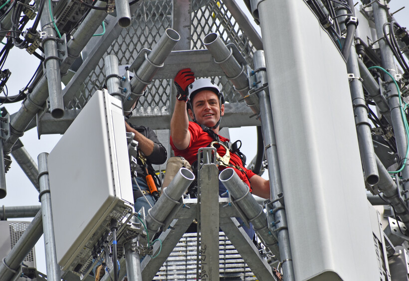 Green Bay Congressman Mike Gallagher looks down from a cell tower in the village of Howard Thursday, Aug. 24, 2023. The climb stemmed from a dare between the legislator and FCC Commissioner Brendan Carr. Joe Schulz/WPR
