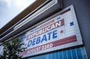 A sign is displayed on the side of the Fiserv forum for the Republican presidential primary debate Wednesday, Aug. 23, 2023, in Milwaukee, Wis. Angela Major/WPR