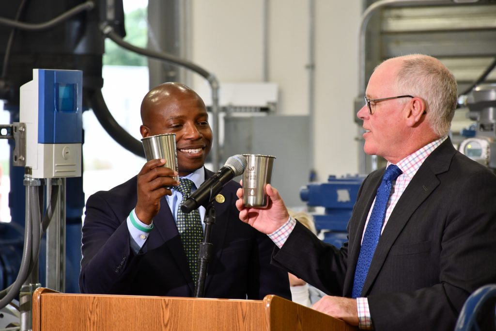 Milwaukee Mayor Cavalier Johnson and Waukesha Mayor Shawn Reilly with a celebratory toast to the Great Water Alliance. Photo by Jeramey Jannene.
