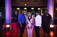 Brittney Rodriguez, center, who won first place in Near West Side Partners’ Rev-Up MKE small business competition, smiles with the other finalists, from left to right, Chyenne Stanley, Jameelah Love, Lisa McKay and Dexter Williams at The Rave/Eagles Club on Wednesday. Photo provided by Kelly Michael Anderson/NNS.
