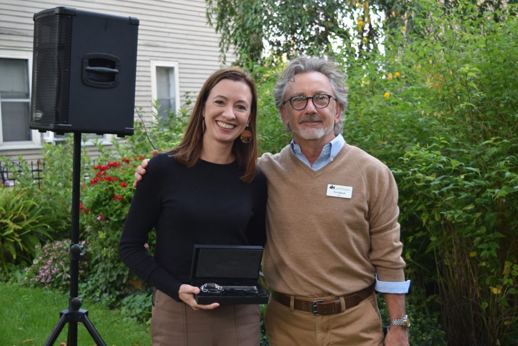Brady Corporation’s Kate Venne, Senior Director of Corporate Communications and Social Responsibility, accepts the 2023 Community Partner Award from Pathfinders' President & CEO Tim Baack.