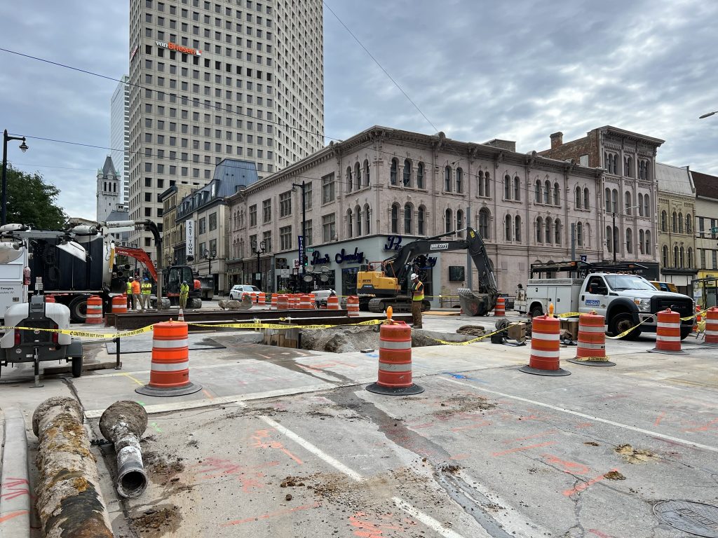 The damaged water main (bottom left) sits while contractors and city workers repair the intersection of N. Broadway and E. Wisconsin Avenue. Photo by Jeramey Jannene.