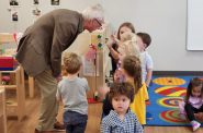 Gov. Tony Evers meets children at Mariposa Learning Center in Fitchburg Wednesday, the day that lawmakers gaveled in a special session he called to address workforce needs, then gaveled back out without action. Photo by Erik Gunn for the Wisconsin Examiner.