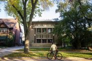 A bicyclist stops to look at Frank Lloyd Wright’s Frederick C. Bogk House on Monday, Oct. 2, 2023, in Milwaukee, Wis. Angela Major/WPR