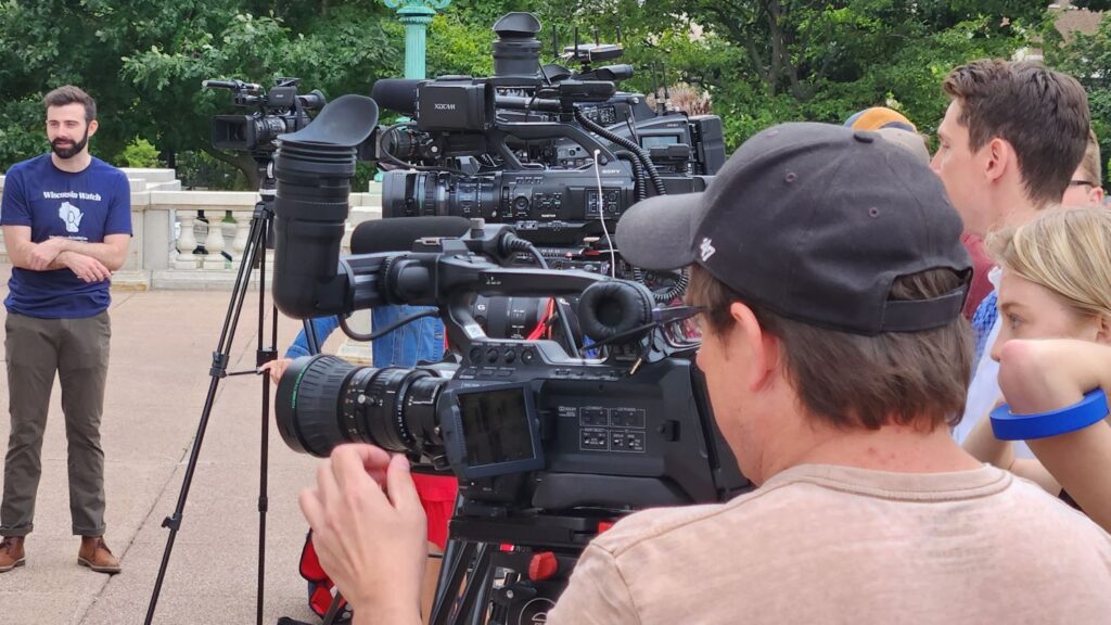 Reporters wait outside the state Capitol for a press conference to begin in September 2023. Wisconsin Watch, a nonprofit investigative reporting news outlet, has voluntarily recognized a union formed by its reporters. Wisconsin Examiner file photo.