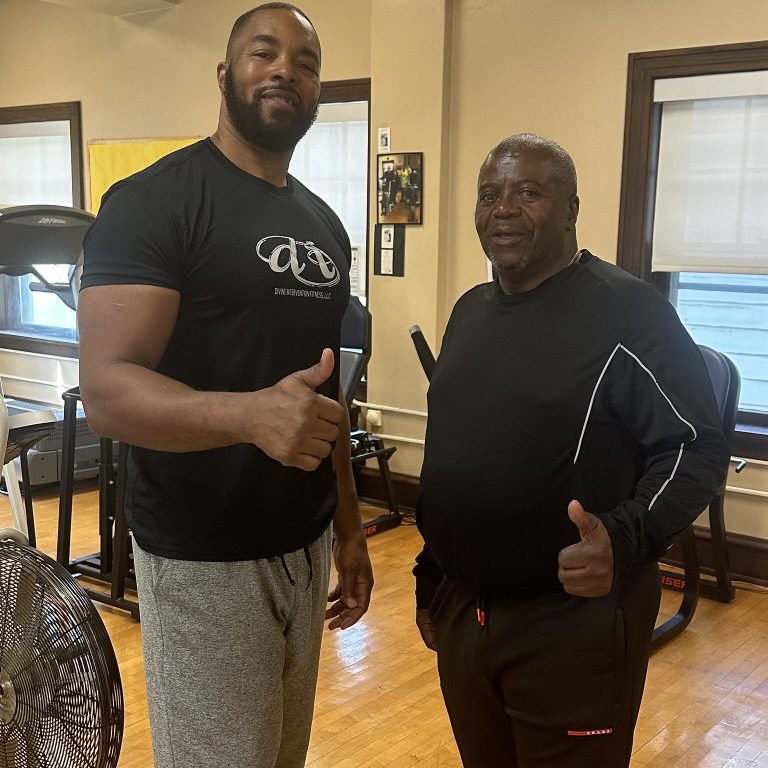 Leonard Wilson (left) trains cancer survivors like Willie Ellis in the gym at the Organization for Active Seniors in Society, or OASIS. Photo by Chesnie Wardell/NNS.