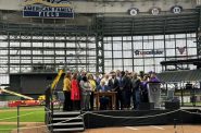 Governor Tony Evers signs a Milwaukee Brewers' stadium financing deal on Dec. 5, 2023. Evan Casey/WPR
