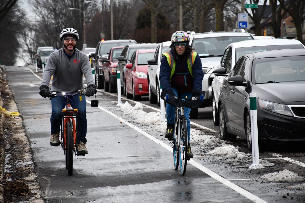 Bike riders on W. Highland Boulevard. Photo by Jeramey Jannene.