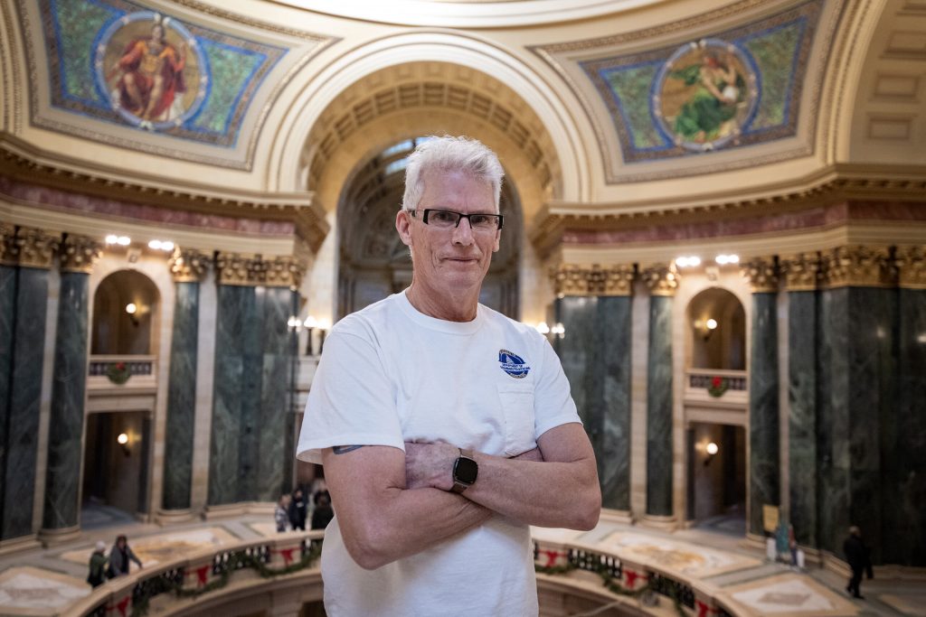Decorative painter Jeff LaMay stands near the Wisconsin State Capitol rotunda Thursday, Dec. 14, 2023, in Madison, Wis. Angela Major/WPR