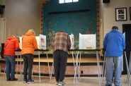 Voters at the Wilmar Neighborhood Center on Madison’s East side cast their ballots. (Henry Redman | Wisconsin Examiner)