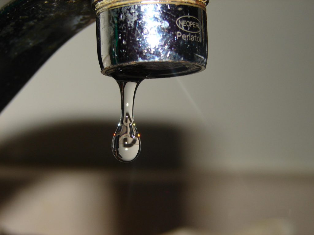 Municipalities are asking residents to keep a small stream of water running from a faucet to prevent frozen pipes. Photo: Public Domain.