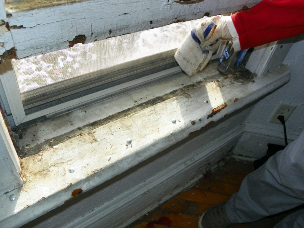 Lead poisoning of children has largely been tied to contact with old, peeling paint. Here, a Milwaukee, Wis. rental home is investigated for lead in a 2015 inspection. (Matt Campbell/For the Wisconsin Center for Investigative Journalism)