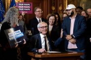 Gov. Tony Evers signs the bill Monday, Feb. 19, 2024, at the Wisconsin State Capitol in Madison, Wis. (Angela Major/WPR)