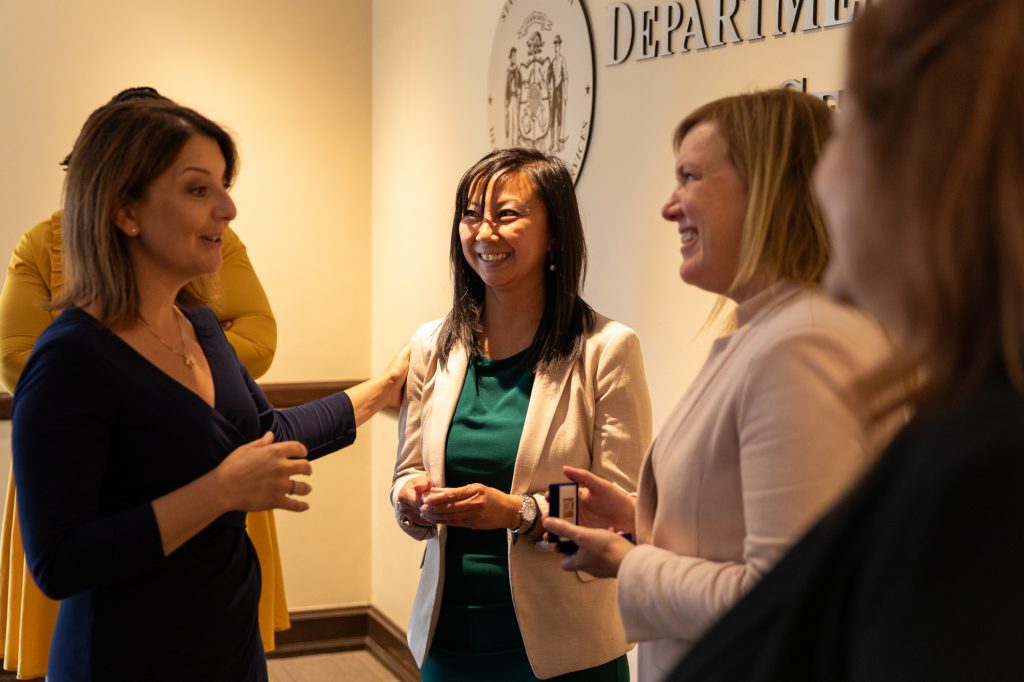 Wisconsin Department of Health Services (DHS) Secretary-designee Kirsten Johnson, right, and State Health Officer Paula Tran, center, speak with Dr. Mandy K. Cohen, left, director of the Centers for Disease Control and Prevention (CDC), when Cohen visited the DHS offices in Madison on Aug. 16, 2023. (Photo courtesy of DHS)