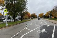 A protected bike lane on W. Lapham Blvd. cut the number of driving lanes in half and reduced speeding by 69%. Photo by Jeramey Jannene.