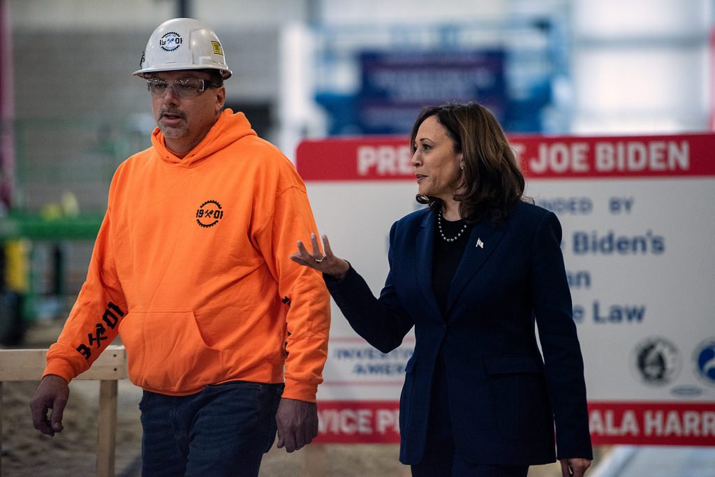 Vice President Kamala Harris, right, walks into a construction site Wednesday, March 6, 2024, during a visit to Madison, Wis. (Angela Major/WPR)