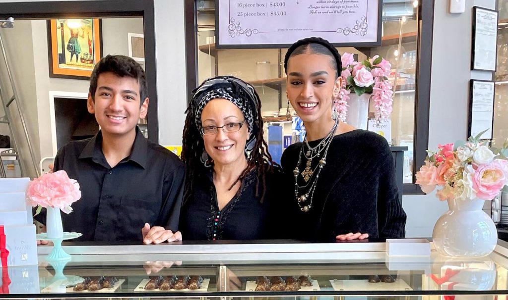 Syovata Edari, middle, with her son Solomon, left, and daugher Emayu, right. Edari says both children grew up being involved with her business, CocoVaa Chocolatier.Photo courtesy Syovata Edari