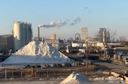 A view of salt piles on Port Milwaukee parcels leased by Compass Minerals looking north from the Lincoln Avenue Viaduct in January 2024. Photo by Michael Timm.