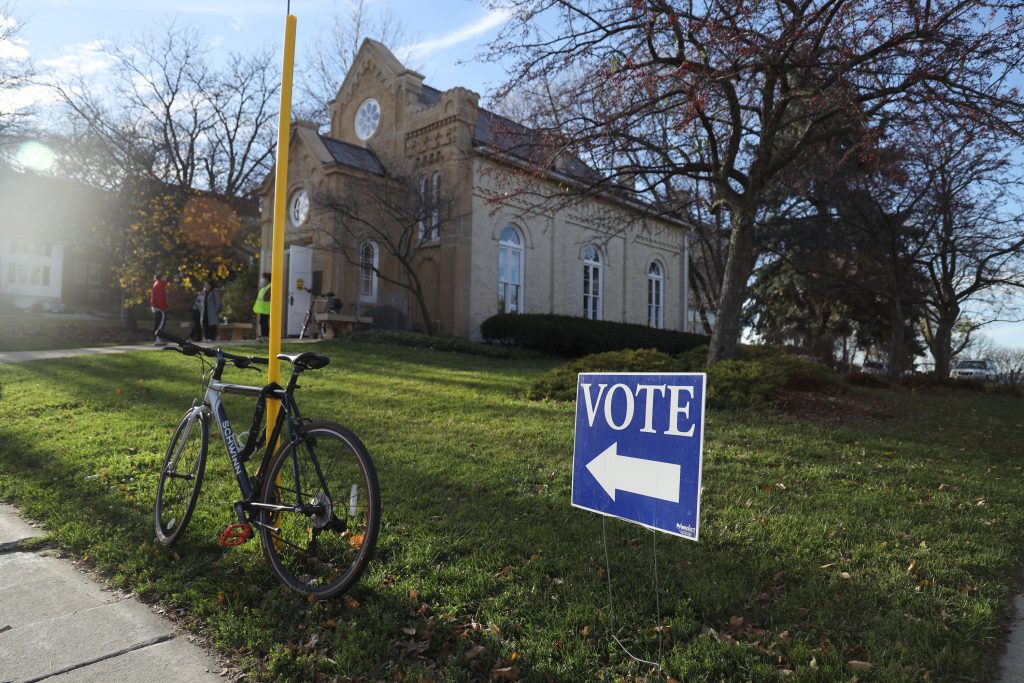 A sign directs voters on Election Day on Nov. 8, 2022, to a polling location inside the Gates of Heaven synagogue in Madison, Wis. Voters on Tuesday will decide on two constitutional amendments affecting election administration. (Amona Saleh / Wisconsin Watch)
