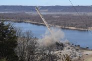 A 500-foot stack is demolished at Dairyland Power Cooperative’s coal-fired power plant in Genoa, Wis. on Tuesday, March 19, 2024. Hope Kirwan/WPR