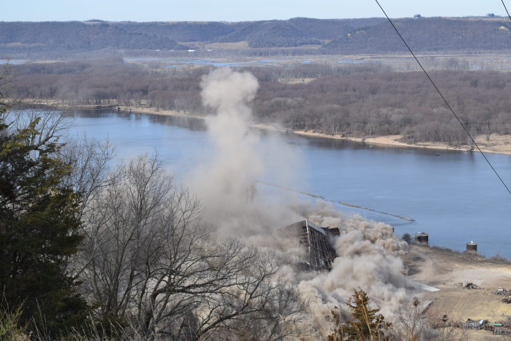 Clouds of dust emanate from the final remains of the Genoa power plant after demolition on Tuesday, March 19, 2024. Hope Kirwan/WPR