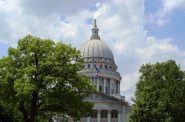 The Progress Pride Flag flies over the Wisconsin Capitol. (Henry Redman | Wisconsin Examiner)