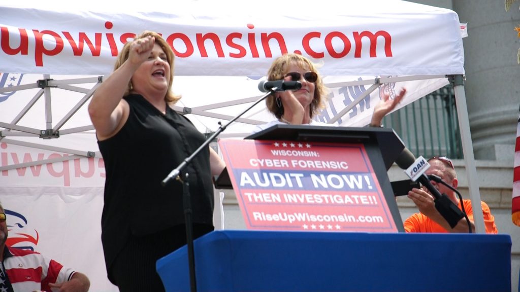 Republican state Rep. Janel Brandtjen, left, and conservative talk show host Vicki McKenna, right, speak at an “Audit the Vote” rally at the state Capitol Friday, Aug. 6, 2021. Will Kenneally/PBS Wisconsin
