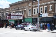A large crowd awaits the reopening of the Downer Theatre. Photo by Jeramey Jannene.