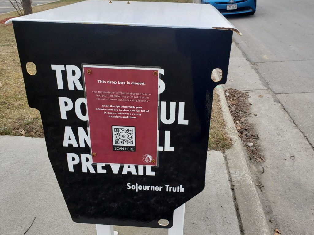 A ballot drop box in Madison, Wisconsin, that has been put out of commission. The city posted a sign explaining why it can no longer be used after a Wisconsin Supreme Court decision banned most absentee ballot drop boxes. (Wisconsin Examiner photo)