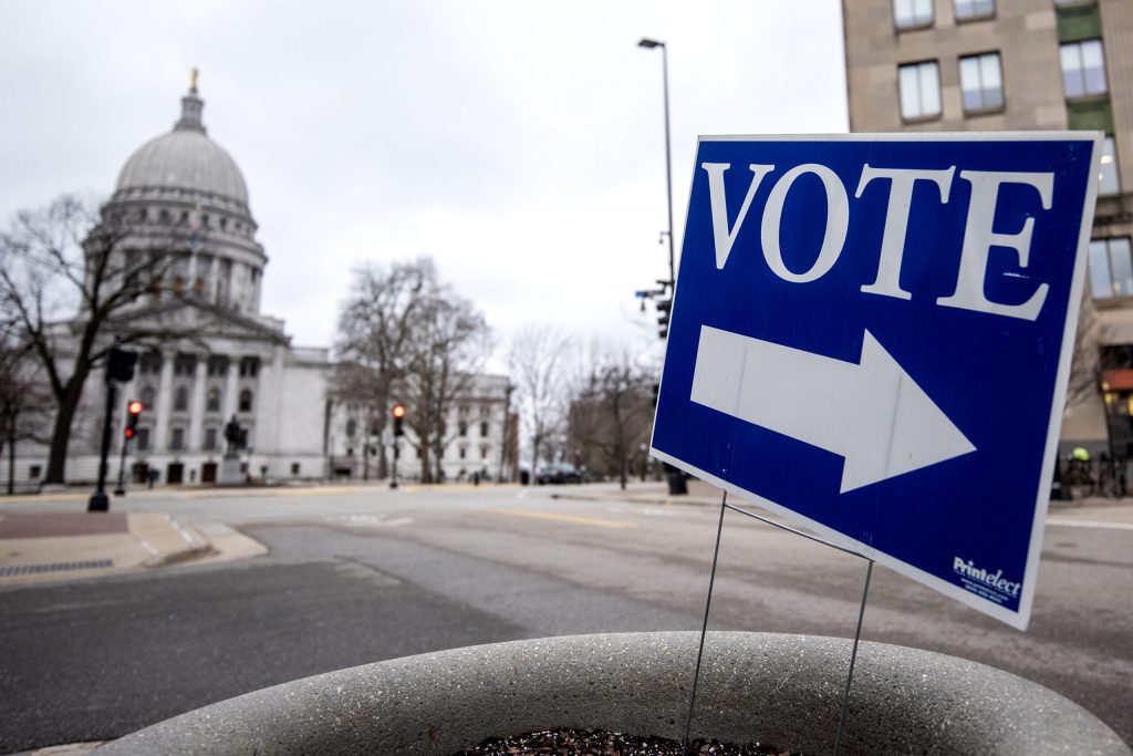 A sign directs voters to a polling location Tuesday, April 4, 2023, in Madison, Wis. Angela Major/WPR