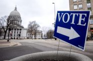 A sign directs voters to a polling location Tuesday, April 4, 2023, in Madison, Wis. Angela Major/WPR