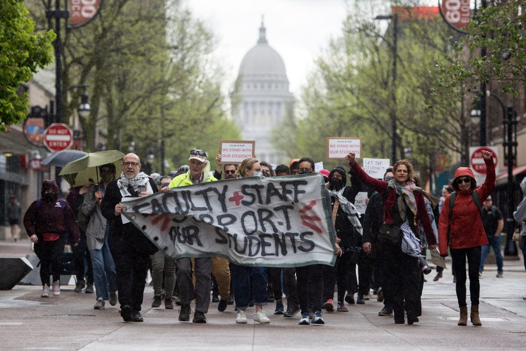 Faculty and staff march down State Street at the beginning of a pro-Palestinian protest Monday, April 29, 2024, at the University of Wisconsin-Madison in Madison, Wis. Angela Major/WPR